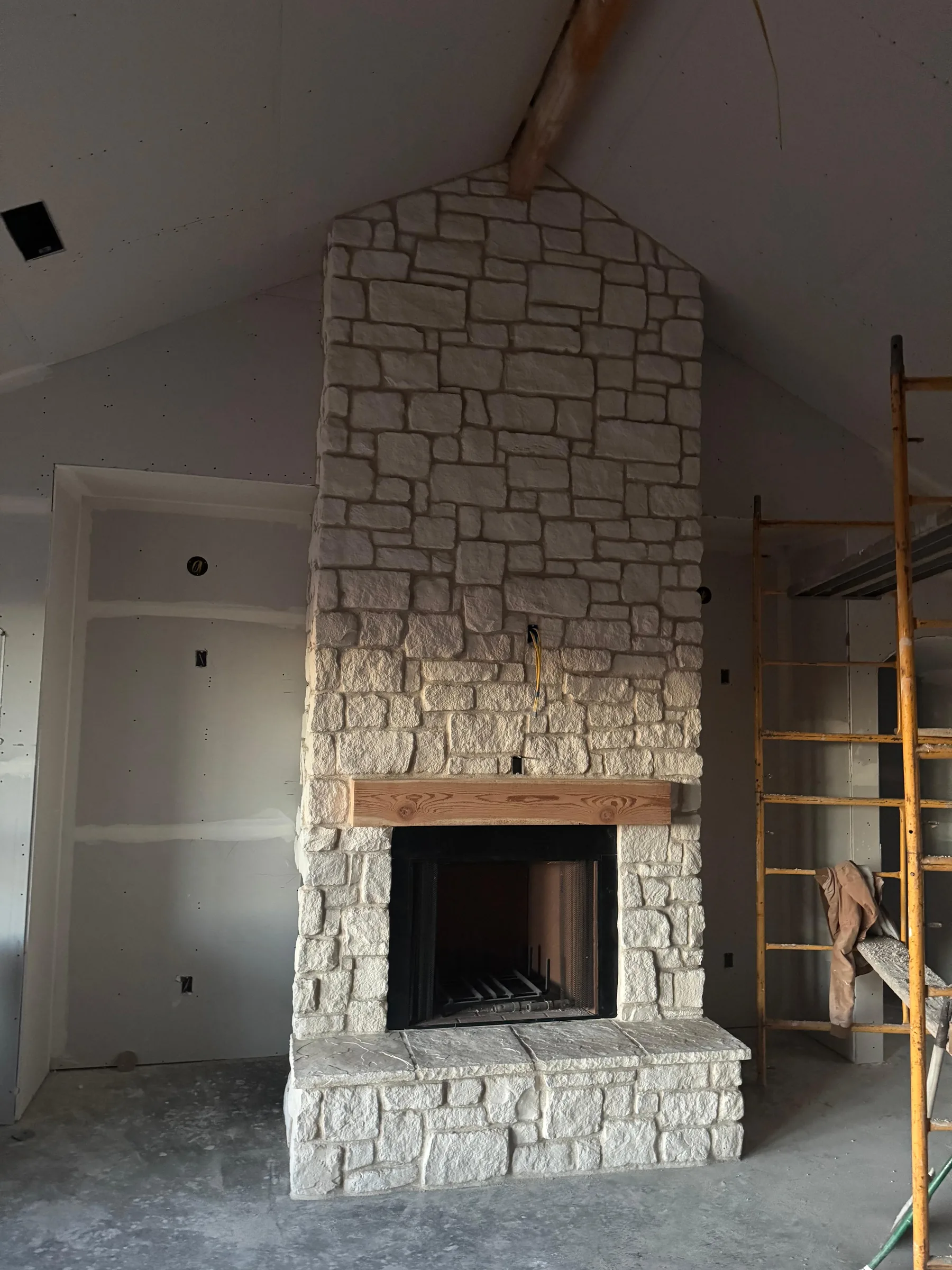 Floor-to-ceiling stone fireplace