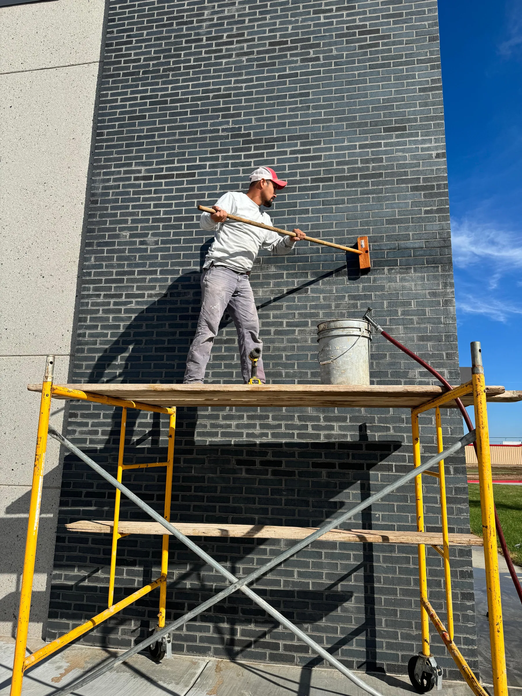 Mason on scaffold